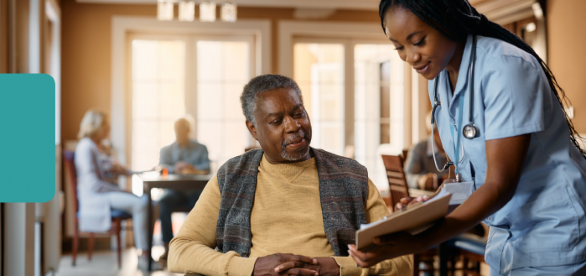 Healthcare professional reviews a care plan with an older adult in a community-based healthcare setting, illustrating patient engagement, Medicare population health management and value-based care.